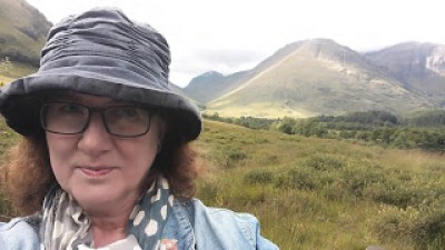 picture of Debbie on Glencoe in rainhat