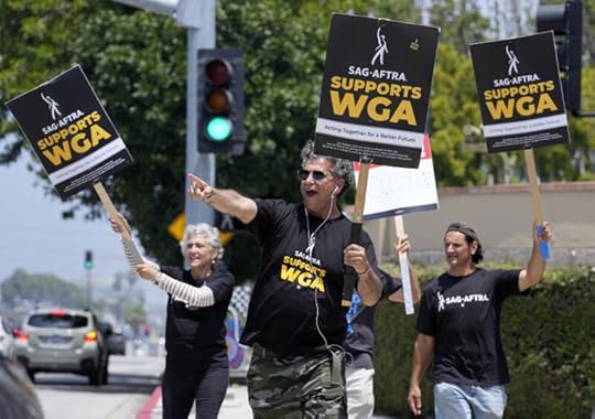 Screen Actors Guild members take part in a Writers Guild rally May 22 outside Warner Bros. Studios in Burbank. ((Chris Pizzello / Associated Press))