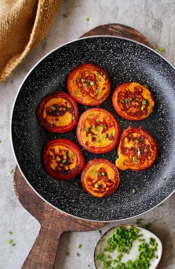 top shot of breakfast tomatoes in black skillet