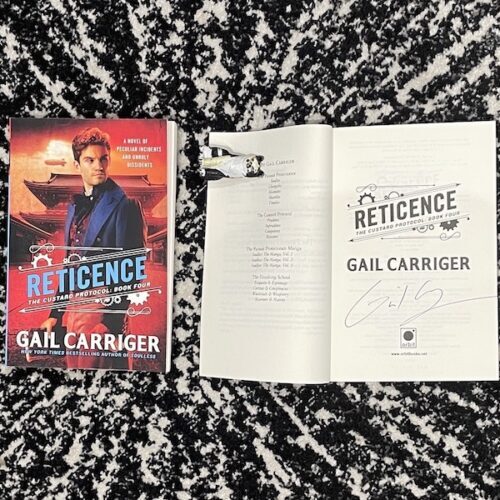 Reticence trade paperback signed