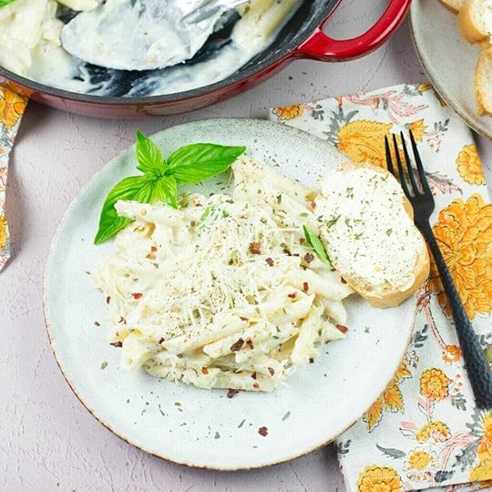 Buttermilk Alfredo Sauce served over pasta on dinner plate.