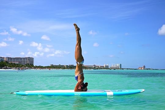 sup yoga paddleboarding at the aruba marriott resort