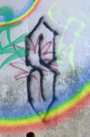 Front cover of Cool S by Die Booth, showing graffiti of Cool S, with an overlaid Pride rainbow
