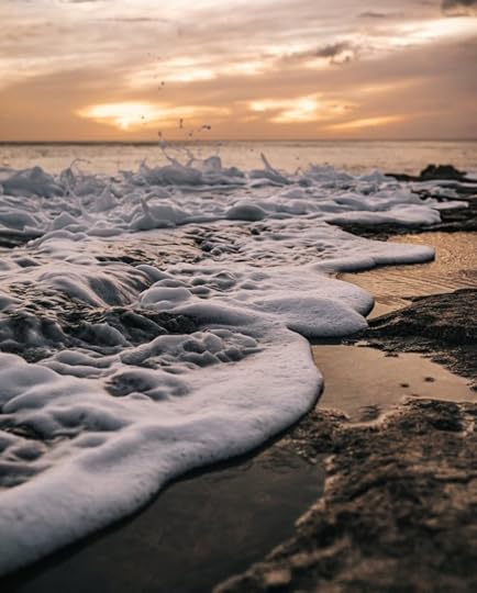 Sea Waves Crashing on Shore during Sunset by KEHN HERMANO