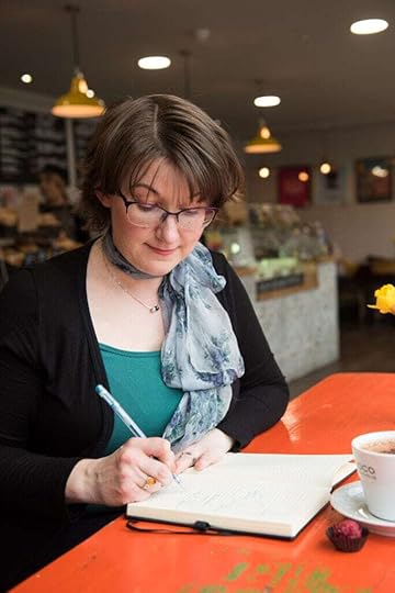Elizabeth writing at desk
