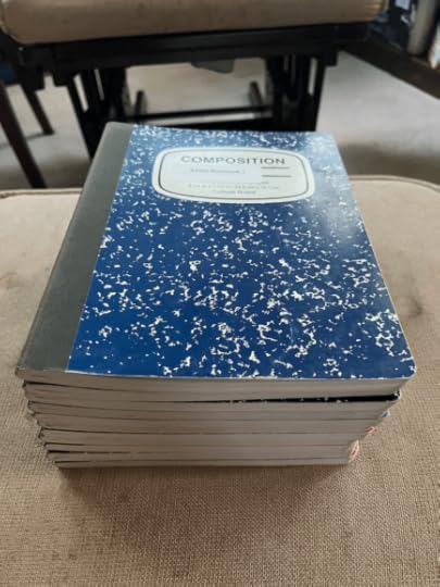 A stack of work notebooks from 2017-2019