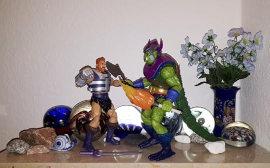 Whiplash holds Fisto at axe point.