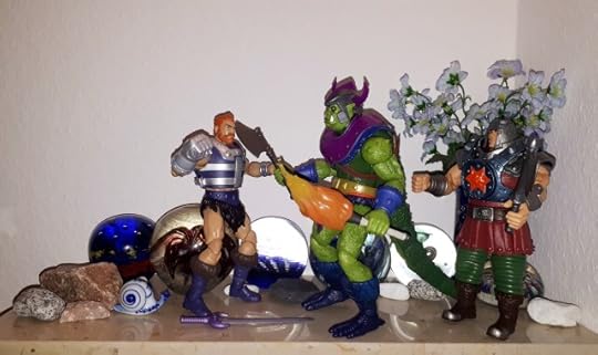 Whiplash threatens Fisto with his axe, while Ram-Man appears behind him.