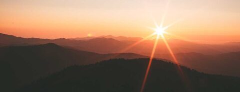 Sunset over mountains illustrating 