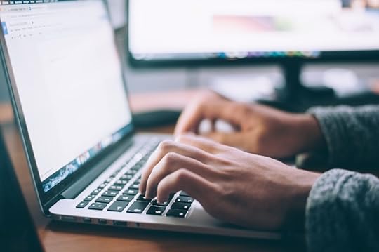 A person using Google Docs on a laptop. Google Docs is one of the top 10 writing tools I recommend every aspiring YA author uses.