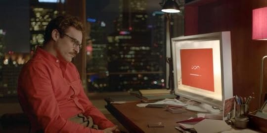 Joaquin Phoenix look at a computer screen in the movie