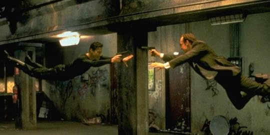 Keanu Reeves as Neo and Hugo Weaving as computerized Agent Smith battle in the air in