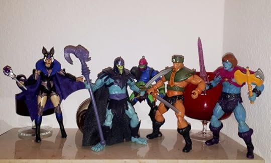 Skeletor holds Tri-Klops at sword point, while Trap Jaw, Faker and Evil-Lyn look on.