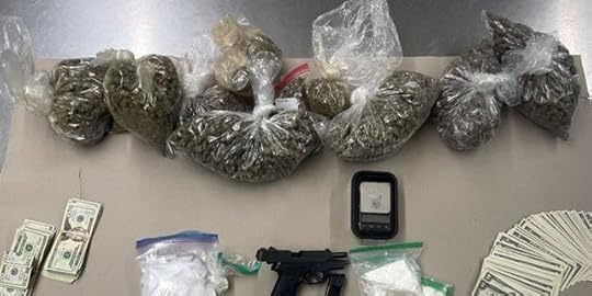 Picture of seized drugs and firearm