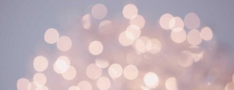 Decorative grey background with light circles. 