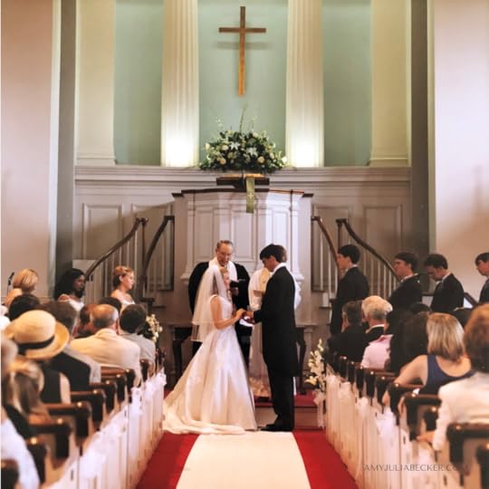 Amy Julia and Peter at the front of a church on their wedding