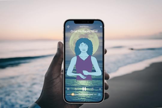Hand holding phone with The Tapping Solution App, doing EFT Tapping for sleep meditation to quiet racing mind