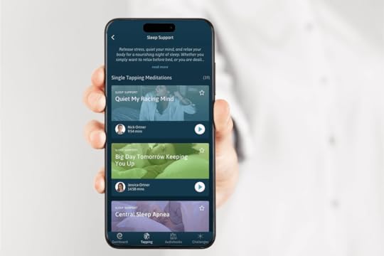 Hand holding phone with The Tapping Solution App, showing EFT Tapping for sleep meditations