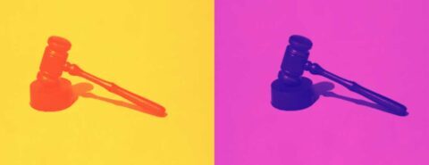 Two gavels on yellow and pink backgrounds to illustrate the blog post 