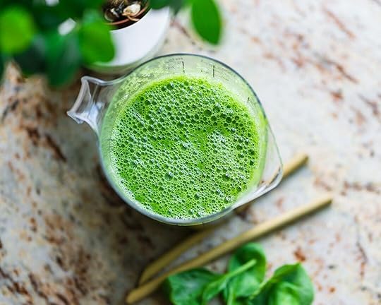 pitcher of green beverage