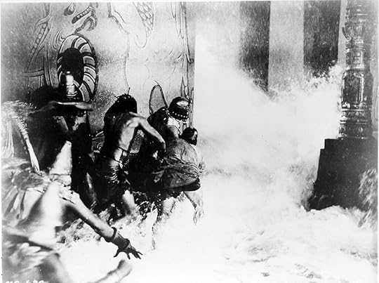 Noah's Ark flood scene - black and white still from 1928 classic showing millions of gallons of water pouring down on extras in costume