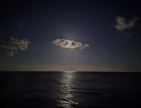Full moon behind clouds
