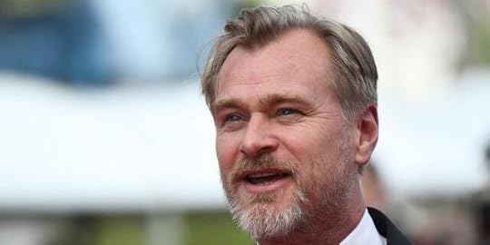 Christopher Nolan looks off in the distance at Cannes Film Festival in a tuxedo