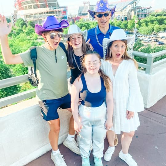 Amy Julia's family makes silly faces on a bridge in Nashville
