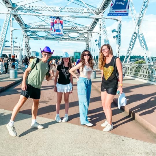 William, Marilee, and two friends pose on a bridge in Nashville