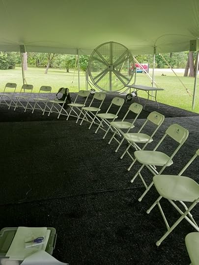 Circle of white folidng chairs