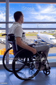 Man in a wheelchair in an airport