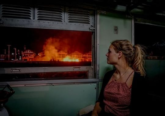 Face your fears or live life afraid? The choice is yours to make. Woman looking out a window at a fire.