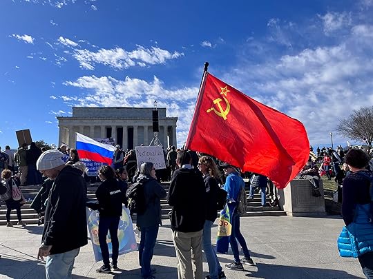 Soviet and Russian flags at Rage Against the War Machine rally