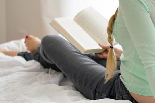 A person reading the ending to a YA novel.