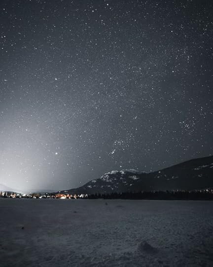 Mountain Near City during Nighttime by Cameron Casey