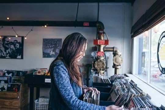 Changing your life step by step. Woman browsing through records.