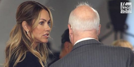 Christine Baumgartner stands in the doorway of the court with her lawyer