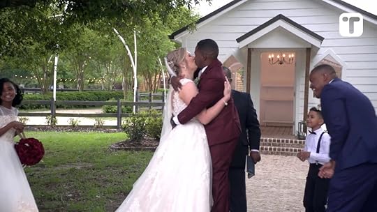 Cheeky father of bride gives short groom step stool to kiss wife at altar