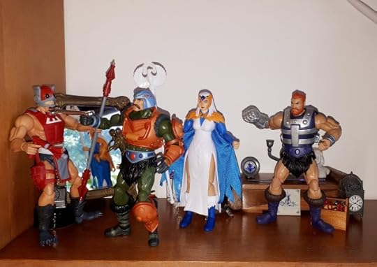 Duncan threatens Zodac with a wrench, while Malcolm and the Sorceress look on.