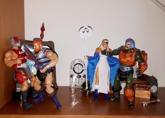 Malcolm punches Zodac, while the Sorceress helps Duncan to his feet.