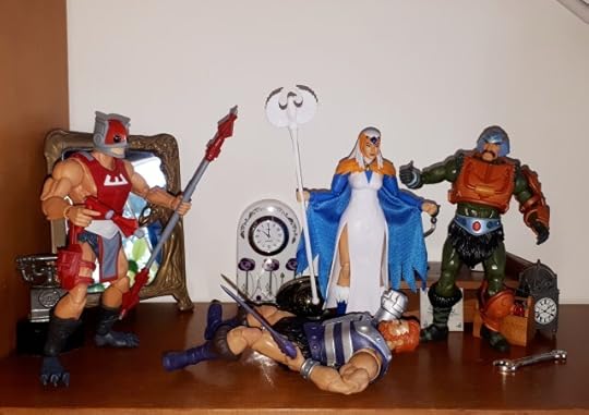 Zodac zaps Malcolm, while Duncan and the Sorceress look on.