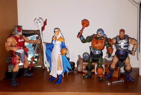 The Sorceress confronts Zodac and her hands glow, while Duncan and Malcolm look on.