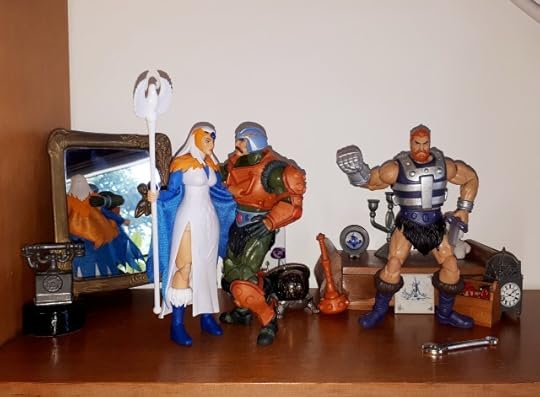 Duncan hugs the Sorceress, while Malcolm shakes his fist at the air.