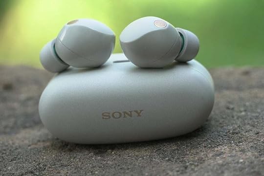 Sony WF-1000XM5 on top of case