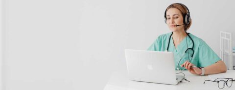 Doctor with headset and laptop for an online medical consultation to illustrate the blog post 