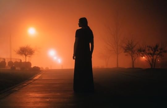 That’s the key to all this. It’s not uncertainty that’s so uncertain – it’s what will come of it. Person in orange haze at night.