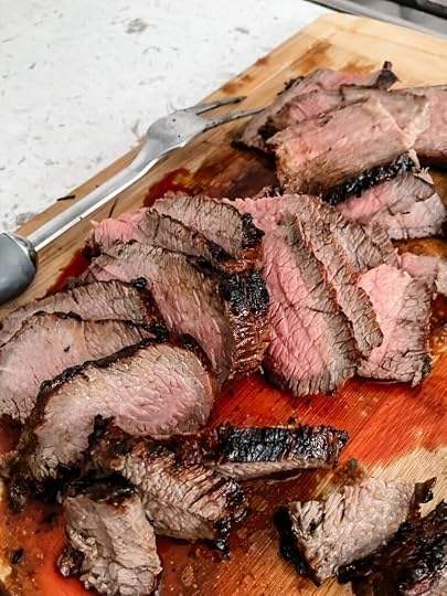 The finished and sliced marinated tri tip steak