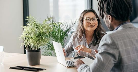 Two sales professionals hold a coaching conversation