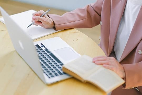 A person writing a quality book review for a YA book.