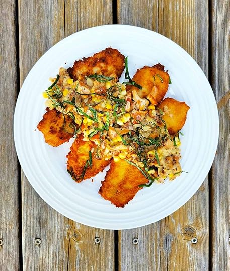 A plate of fried walleye with chanterelle sauce.